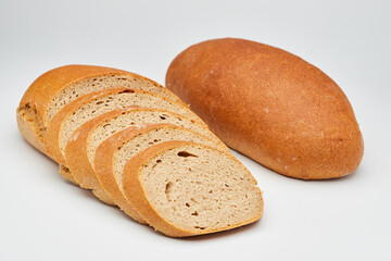 Whole wheat bread loaf sliced, showcasing its hearty texture and rich, wholesome flavor