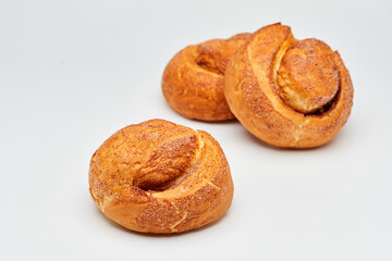 Freshly baked cinnamon roll with a golden crust and a sprinkle of sugar, perfect for a sweet treat
