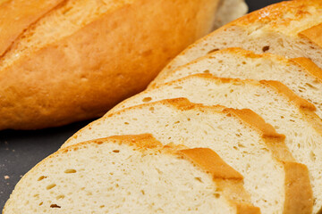 Golden, freshly sliced loaf of homemade bread, perfect for sandwiches, breakfast, or toasting