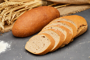 Whole wheat bread loaf sliced, showcasing its hearty texture and rich, wholesome flavor