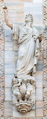Fototapeta premium Milan - The St. John the apostle statue from west facade of Duomo cathedral by Pacetti Camillo (1758 - 1822).