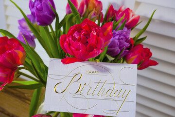 postcard , Internet banner  with a birthday greeting, with the inscription - happy birthday,  a bouquet of flowers with a note of congratulations