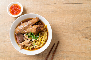 egg noodles with stewed and braised duck in brown soup