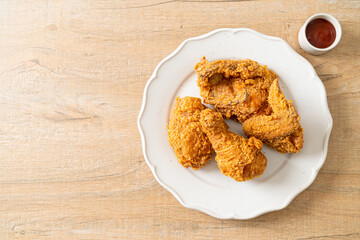 fried chicken with ketchup on plate