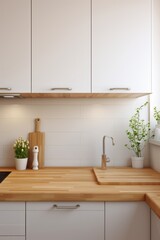 White kitchen cabinets with wooden countertop and a silver faucet.