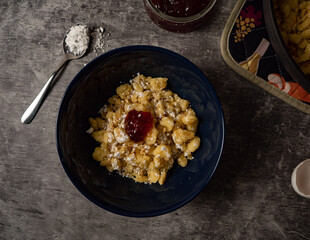 Traditional bavarian dessert called kaiserschmarrn, sprinkled with powdered sugar, top view