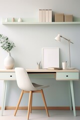 Minimalist home office desk with a white chair, a lamp, and a vase with green leaves.