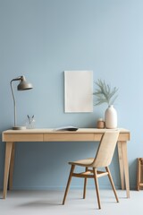 Light wooden desk with a chair against a blue wall, with a lamp and vase.