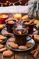 Christmas mulled wine in glass mugs with ginger cookies