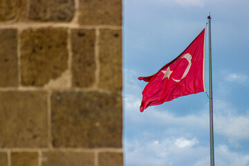 29 Ekim Cumhuriyet Bayrami kutlu olsun or Happy 101th anniversary of the 29th october Republic day of Turkey. Turkish flag waving against the sky with space for text, symbolizing national pride.