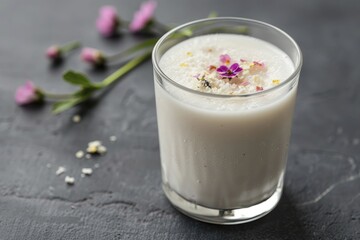 Frozen milk infused with flowers creates a delicate artistic display, merging nature with refreshment for an eye-catching and refreshing experience.