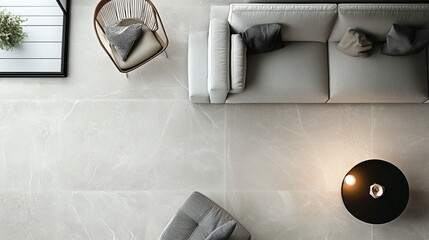 Top view of a contemporary tile pattern with large, smooth tiles in a light gray, creating a minimalist and modern look on a living room floor