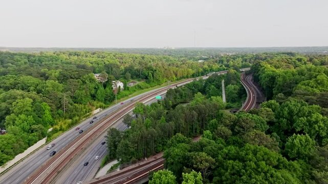 Aerial view of vehicles driving through T. Harvey Mathis Parkway to Downtown Buckhead in Atlanta, Buckhead neighbourhood green parks and trails