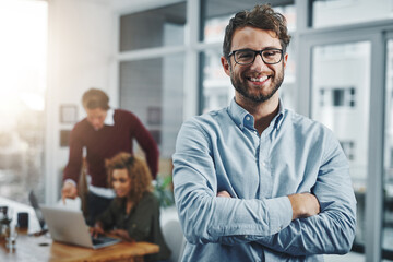 Portrait, business and man with arms crossed, glasses and happiness with startup, smile or confidence. Face, people or employee with coworkers, career ambition or agency for web design and office