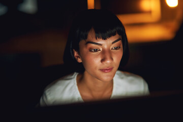 Computer, face and night with woman in web development office for project deadline or shift work. Desktop, programming and website design with asian employee in creative workplace for administration