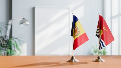 FLAGS OF ANDORRA AND KIRIBATI  ON TABLE