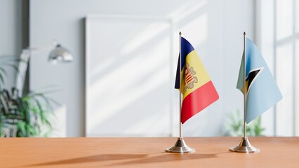 FLAGS OF ANDORRA AND SAINT LUCIA ON TABLE