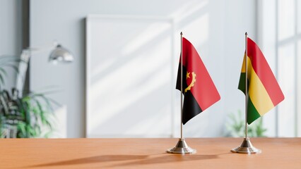 FLAGS OF ANGOLA AND BOLIVIA  ON TABLE