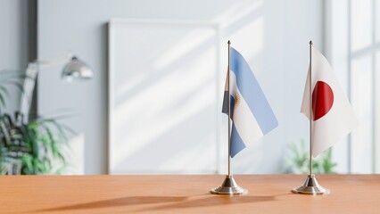 FLAGS OF ARGENTINA AND JAPAN  ON TABLE