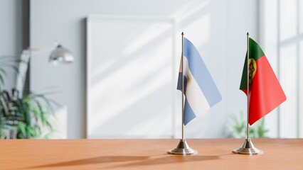 FLAGS OF ARGENTINA AND PORTUGAL  ON TABLE