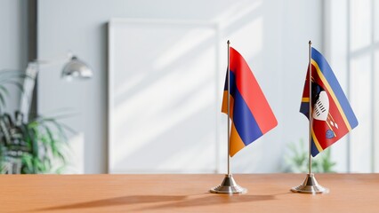 FLAGS OF ARMENIA AND ESWATINI  ON TABLE