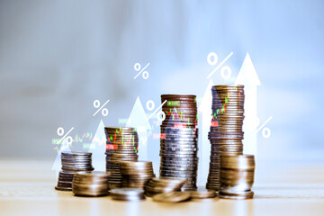 dividend and Interest rate concept. symbol and arrow pointing up  on gold coins instead Return on Stocks and Mutual Funds long-term investment. income return retirement fund at stock market.