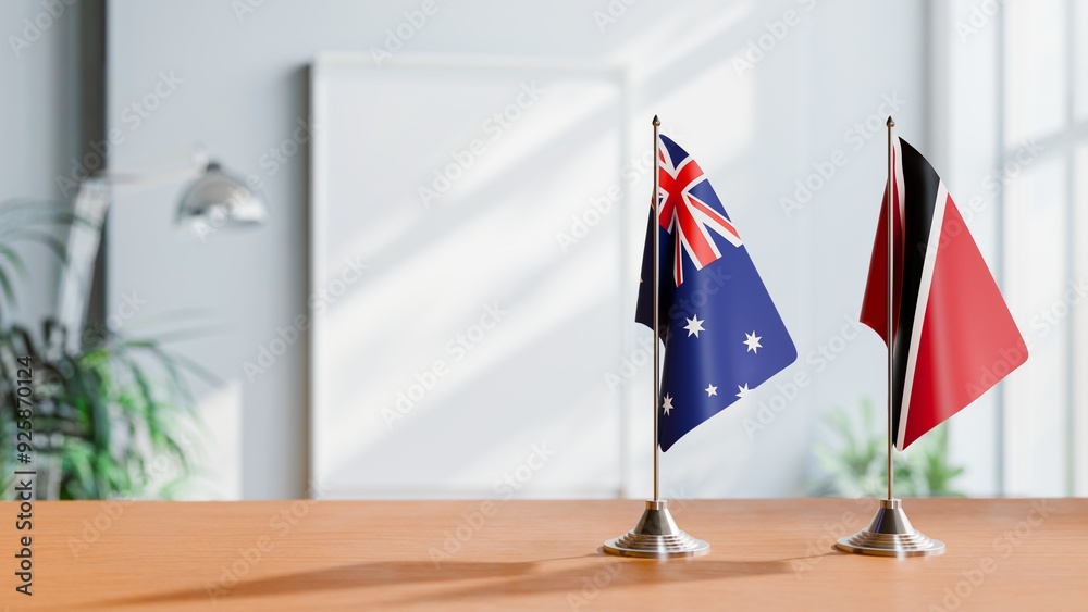 Wall mural flags of australia and trinidad on table