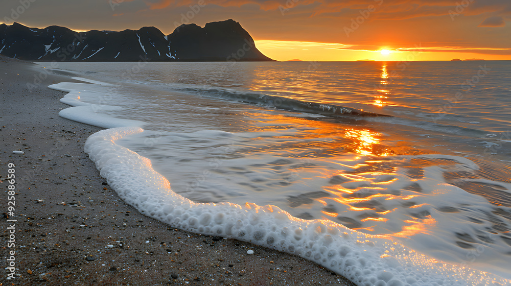 Wall mural amazing beach sunset with foamy waves. volcanic hills in the background.