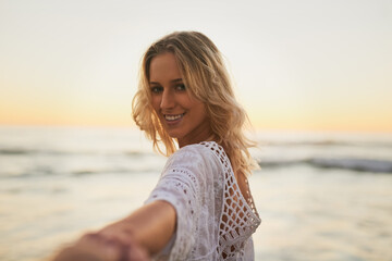 Invite, portrait and woman in beach, outdoor and happy for peace in vacation, waves and helping hand. Nature, travel and offer of adventure in holiday, water and person in sea with smile in Greece