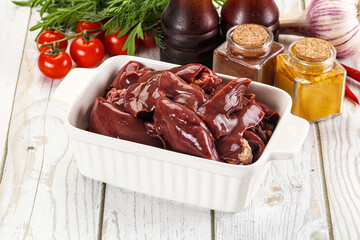Raw chicken liver uncooked in the bowl