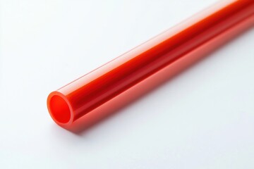 Detailed view of a crimson eco-friendly straw set against a light background, featuring an isolated design for convenient application