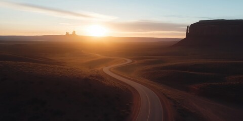 A road curves and winds it's way through Monument Valley. With Copy Space