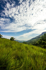 Spectacular cloudscape of high-altitude alto-cumulus clouds above the afromontane grasslands of the Drakensberg Mountains of South Africa
