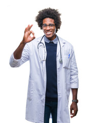 Afro american doctor man over isolated background smiling positive doing ok sign with hand and fingers. Successful expression.