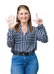 Middle age mature business woman over isolated background showing and pointing up with fingers number seven while smiling confident and happy.