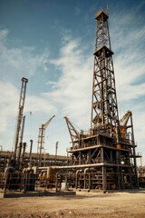 Oil field for extracting fossil fuels from the ground. Oil drilling rigs in the desert