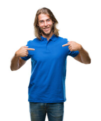 Young handsome man with long hair over isolated background looking confident with smile on face,...