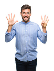 Naklejka premium Young handsome man over isolated background showing and pointing up with fingers number nine while smiling confident and happy.