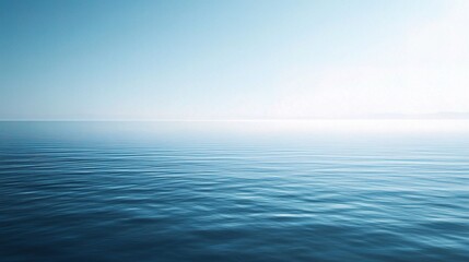 Obraz premium Serene Horizon: A breathtaking view of a vast, tranquil ocean, where the sky and water seamlessly blend, creating a sense of endless peace and serenity. 