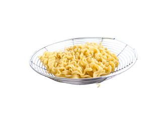 Instant noodles served dry on a white background