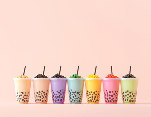 free space of variety of bobba bubble milk tea  plastic cups standing in a line on pink background