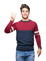 Fototapeta premium Young handsome man over isolated background showing and pointing up with fingers number three while smiling confident and happy.