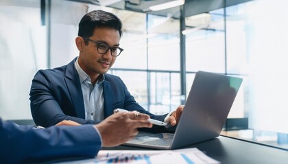 Female and Male Indian Financial Advisers Use Laptop Computer to Discuss a Stock Market Strategy in a Modern Company. South Asian Managers Collaborate