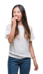 Young asian woman eating donut over isolated background with a confident expression on smart face thinking serious