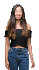 Fototapeta premium Young asian woman over isolated background with a happy and cool smile on face. Lucky person.