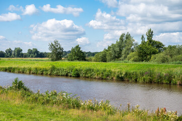 Green banks of the River Ochtum at the Kladdinger Wiesen at the borders of Bremen, Germany
