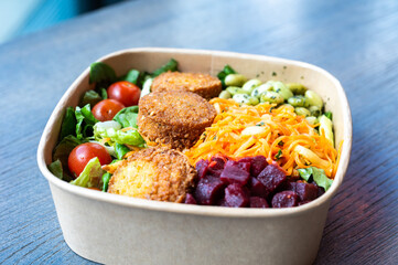 Bowl of peas, vegetables and falafel, a vegan dish in Bremen, Germany