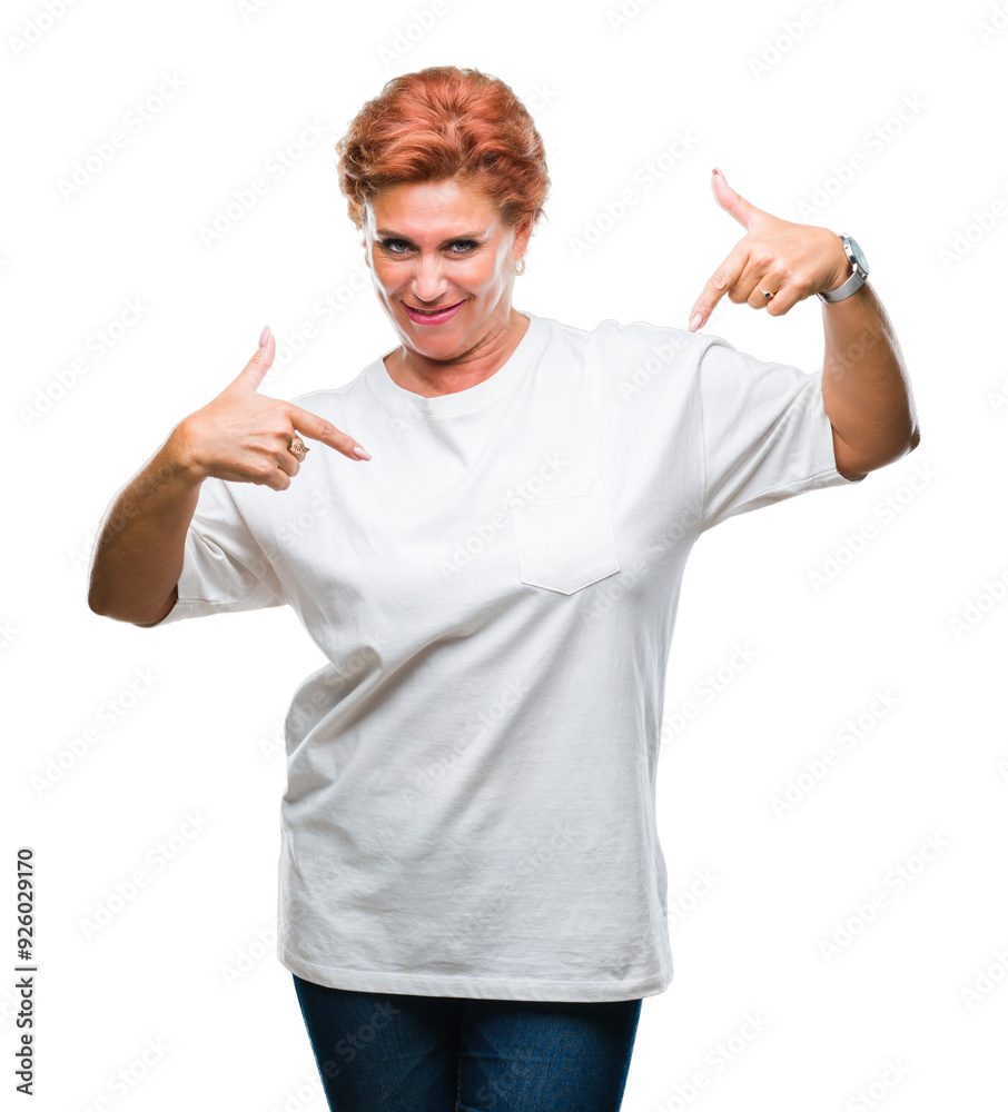 Wall mural Atrractive senior caucasian redhead woman over isolated background looking confident with smile on face, pointing oneself with fingers proud and happy.