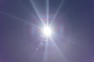 Fototapeta premium powerful light source directly hitting the camera, light beams, and the central round light source