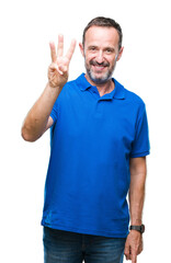 Fototapeta premium Middle age hoary senior man over isolated background showing and pointing up with fingers number three while smiling confident and happy.